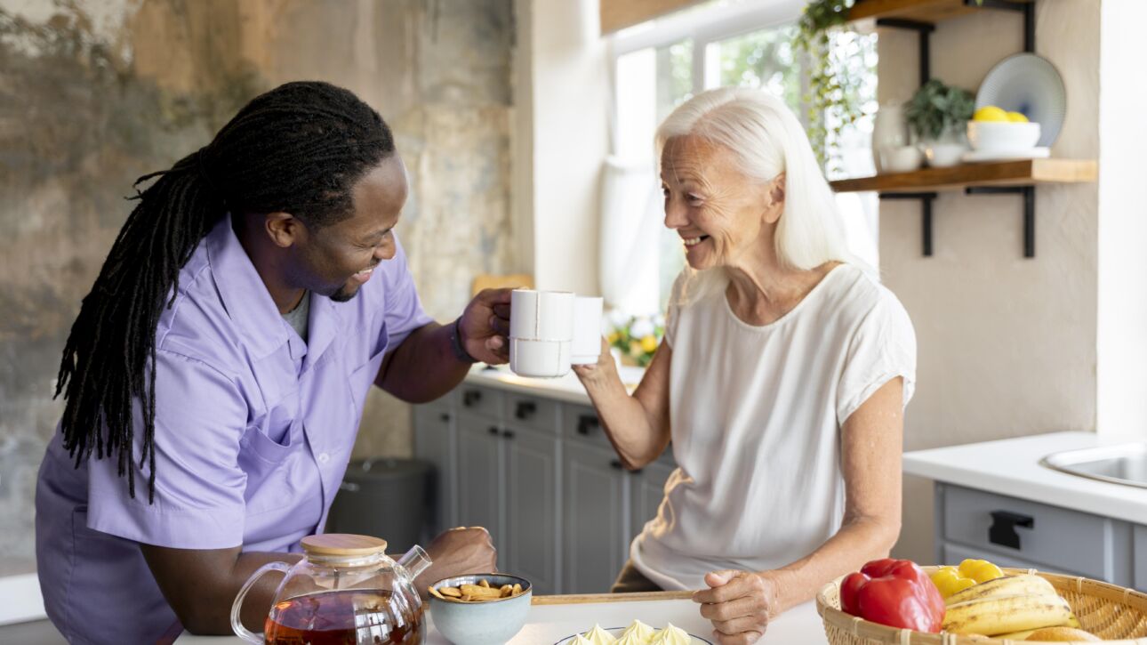 african-social-worker-helping-senior-woman